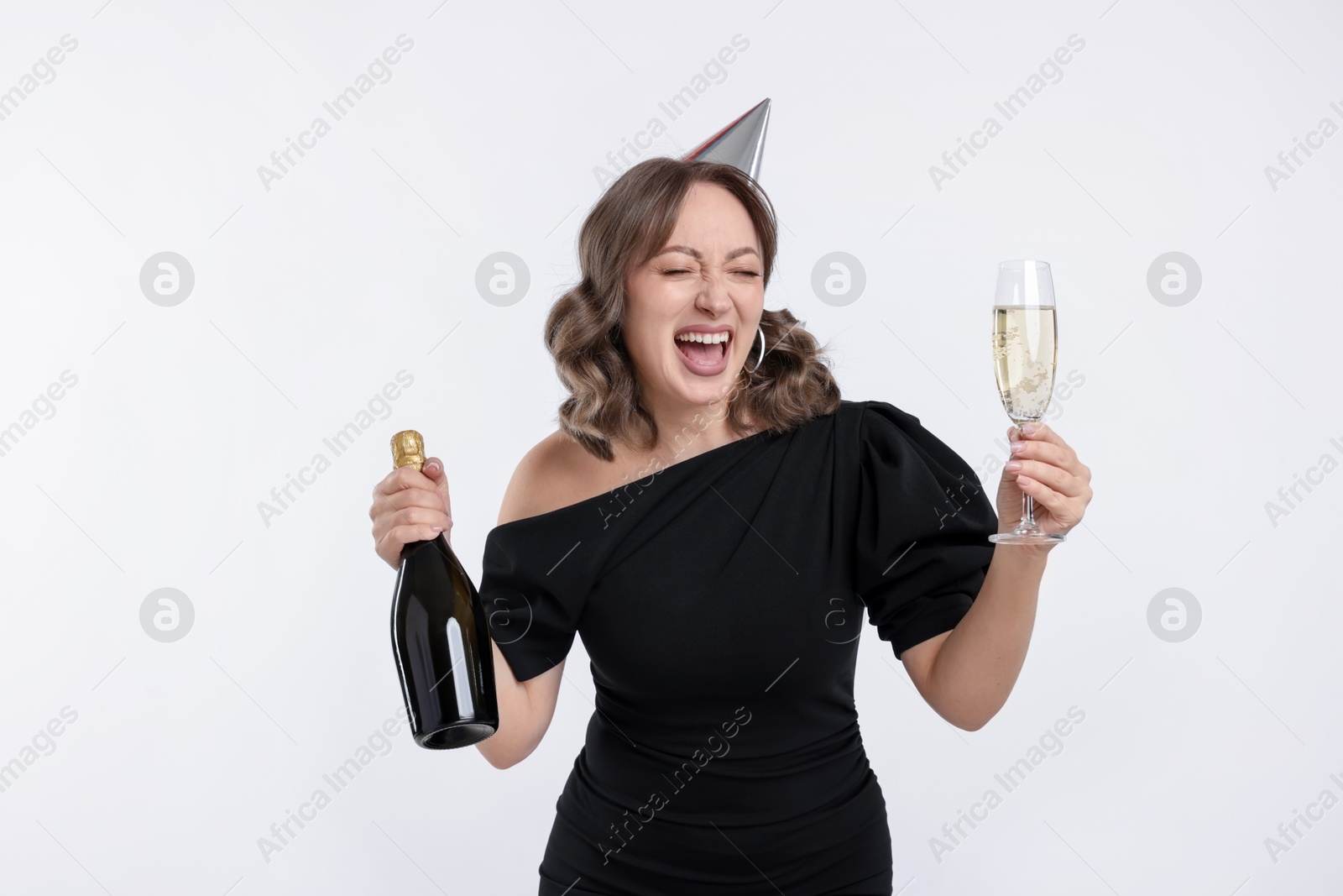 Birthday celebration. Woman with sparkling wine on white background Photo of Birthday celebration. Woman with sparkling wine on white background