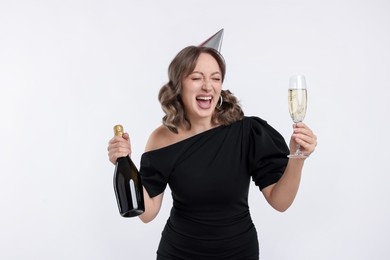 Photo of Birthday celebration. Woman with sparkling wine on white background