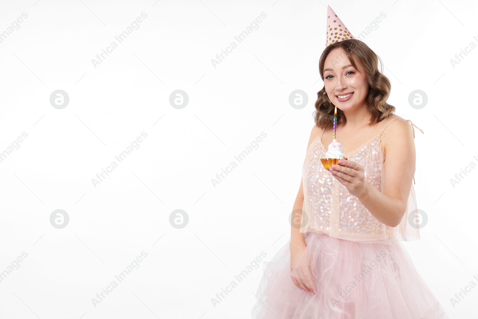 Birthday celebration. Woman with cupcake on white background. Space for text Photo of Birthday celebration. Woman with cupcake on white background. Space for text