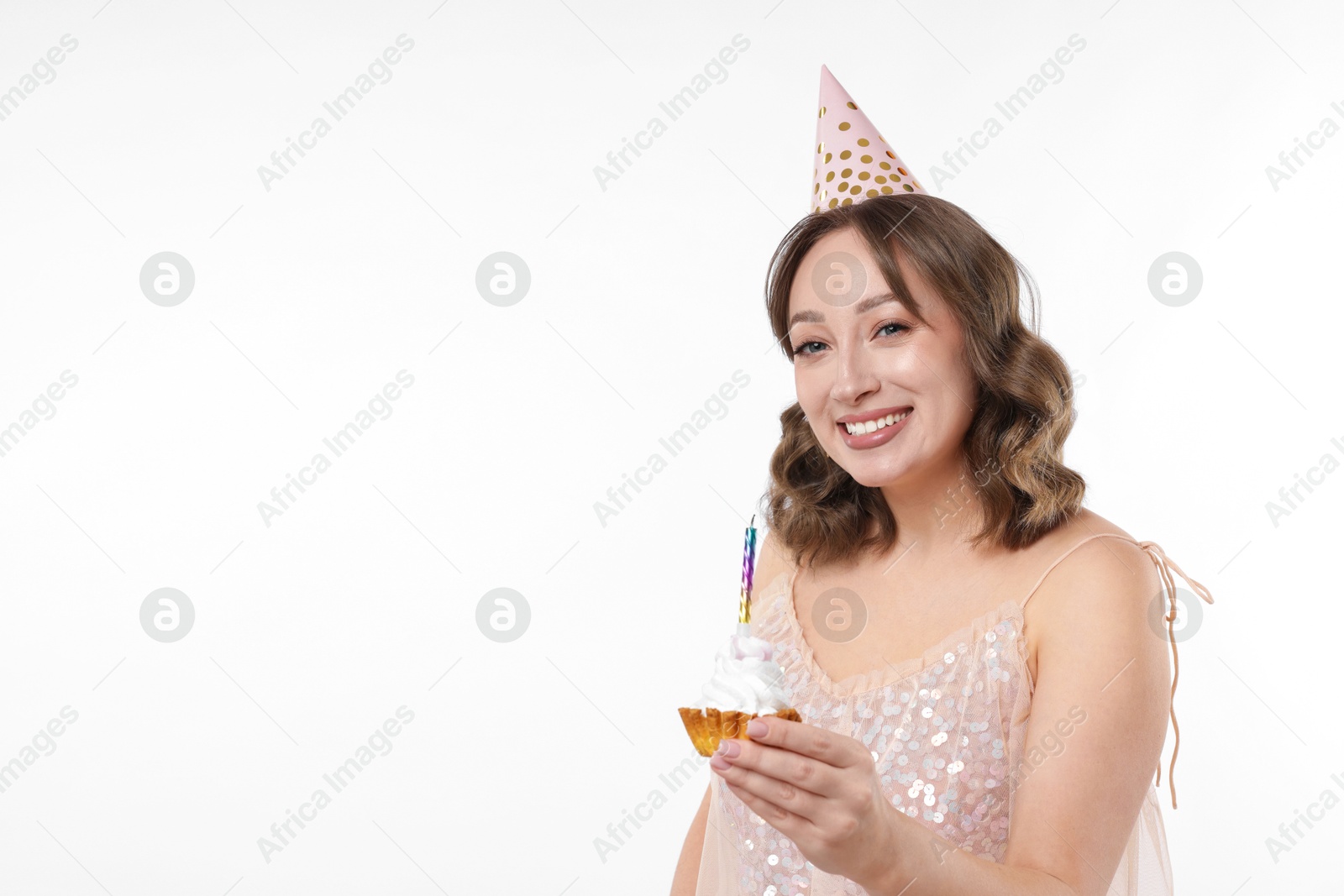 Birthday celebration. Woman with cupcake on white background. Space for text Photo of Birthday celebration. Woman with cupcake on white background. Space for text