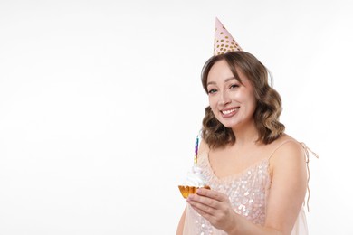 Photo of Birthday celebration. Woman with cupcake on white background. Space for text