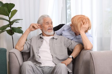Photo of Lovely senior couple spending time together at home