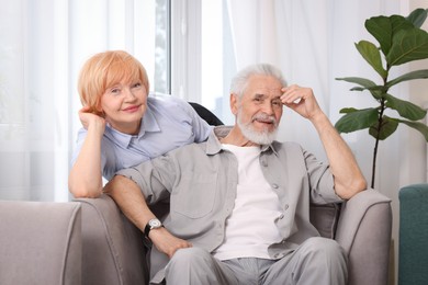 Photo of Lovely senior couple spending time together at home