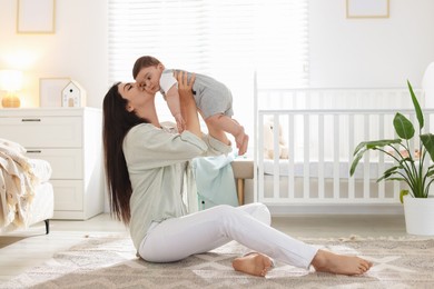 Photo of Mother with her cute baby at home. Space for text