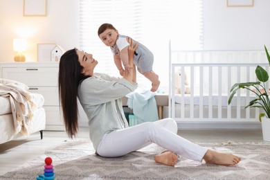Photo of Mother with her cute baby at home. Space for text