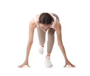 Photo of Runner in starting position on white background