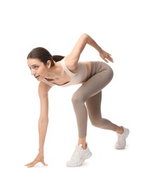 Photo of Runner in starting position on white background