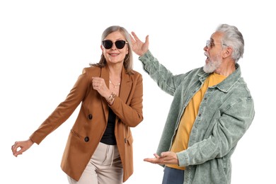 Photo of Senior couple in stylish outfits on white background
