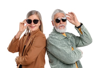 Photo of Senior couple in stylish outfits on white background
