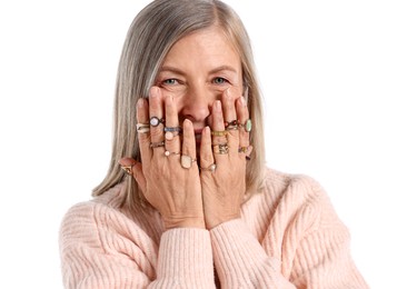 Photo of Senior woman wearing different rings on white background