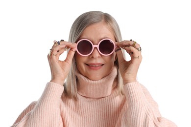 Photo of Senior woman wearing different rings and sunglasses on white background