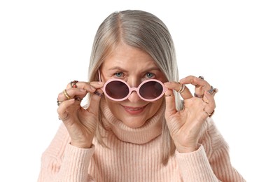 Photo of Senior woman wearing different rings and sunglasses on white background