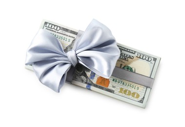 Photo of Money bonus. Dollar banknotes with bow isolated on white, top view