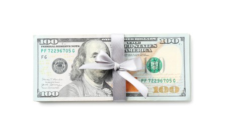 Photo of Money bonus. Dollar banknotes with bow isolated on white, top view