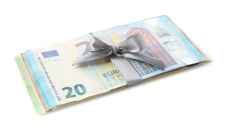 Photo of Money bonus. Euro banknotes with bow isolated on white