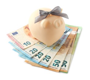 Photo of Money bonus. Piggybank with euro banknotes isolated on white