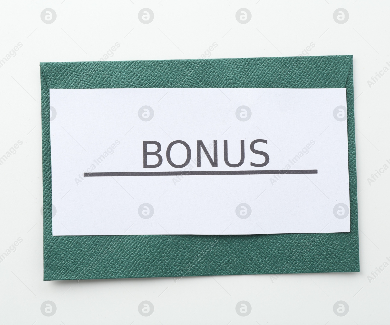 Envelope with word Bonus on white background, top view Photo of Envelope with word Bonus on white background, top view