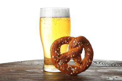 Photo of Tasty pretzel and glass of beer on wooden table against white background
