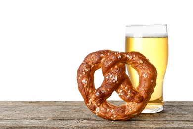 Photo of Tasty pretzel and glass of beer on wooden table against white background. Space for text
