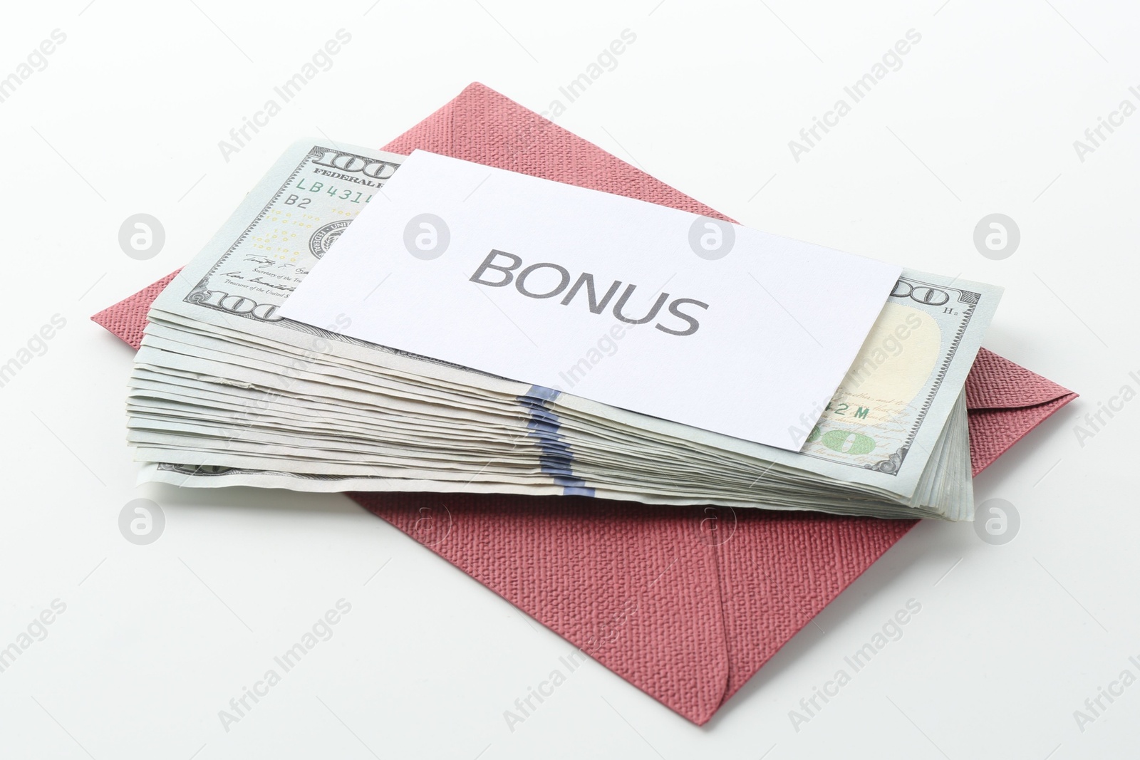 Envelope with word Bonus and dollar banknotes on white background Photo of Envelope with word Bonus and dollar banknotes on white background