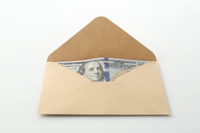 Photo of Money bonus. Envelope with dollar banknotes on white background