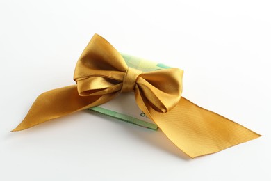 Photo of Money bonus. Euro banknotes with bow on white background