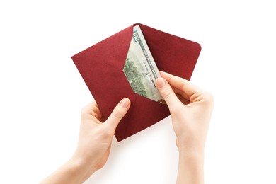 Photo of Money bonus. Woman holding envelope with dollar banknotes on white background, closeup