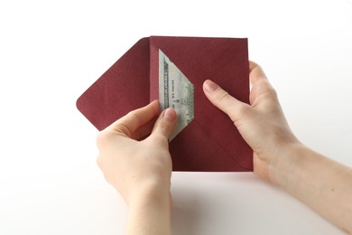 Photo of Money bonus. Woman holding envelope with dollar banknotes on white background, closeup