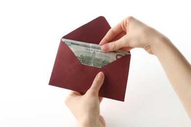 Photo of Money bonus. Woman holding envelope with dollar banknotes on white background, closeup