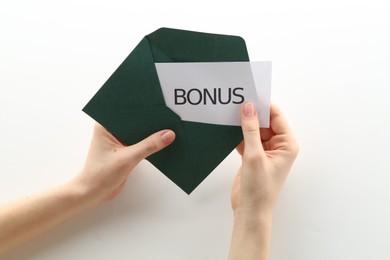 Photo of Woman holding envelope with word Bonus on white background, closeup
