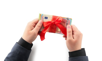 Photo of Money bonus. Man holding euro banknotes with bow on white background, closeup