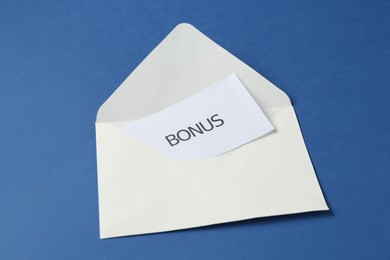 Photo of Envelope with word Bonus on blue background
