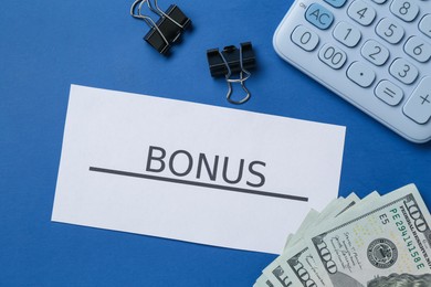 Photo of Card with word Bonus, money, calculator and clips on blue background, flat lay