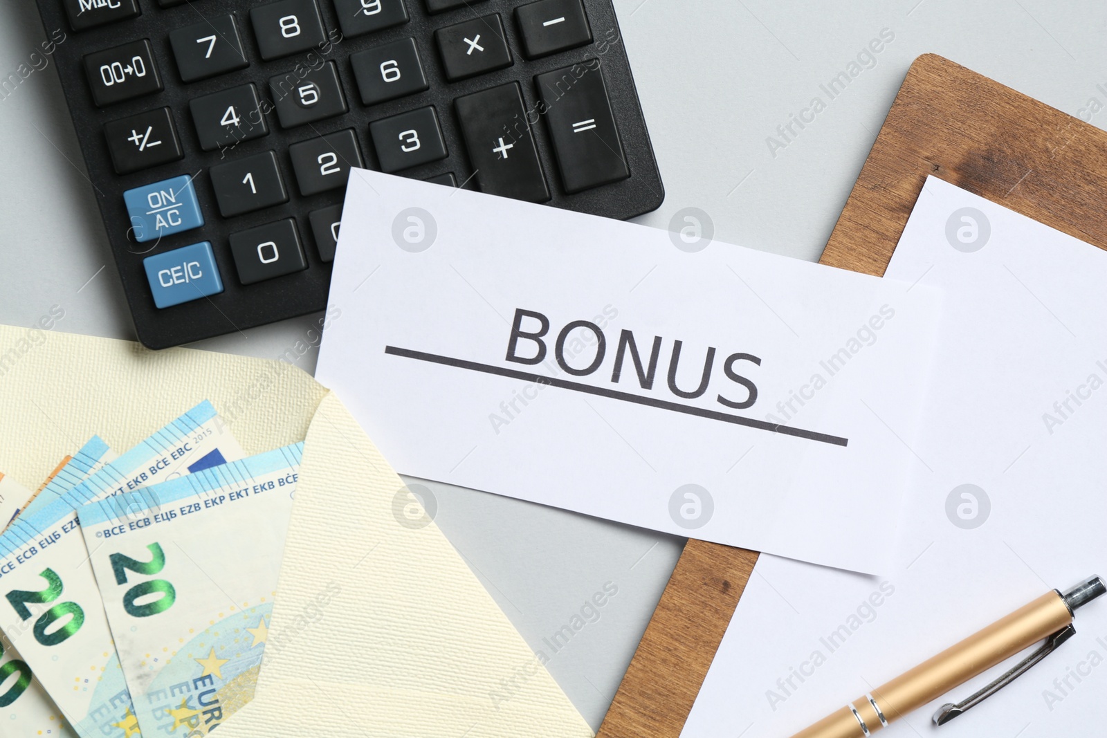 Card with word Bonus, money, clipboard and calculator on light grey background, flat lay Photo of Card with word Bonus, money, clipboard and calculator on light grey background, flat lay