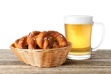 Photo of Tasty pretzels and glass of beer on wooden table against white background