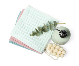 Photo of Clean waffle towels, soap and eucalyptus isolated on white, top view