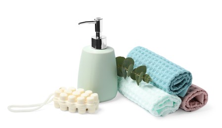 Photo of Clean waffle towels, soap and eucalyptus isolated on white