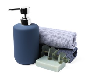 Photo of Clean waffle towels, soap and eucalyptus isolated on white