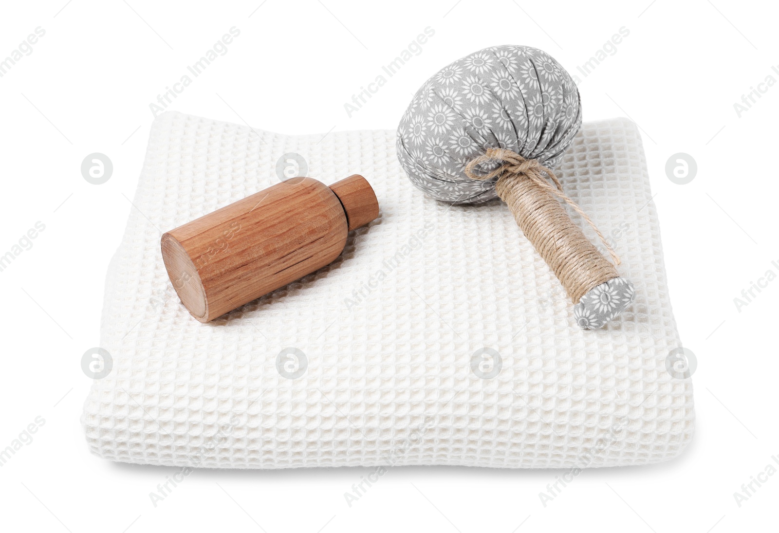 Clean waffle towel, cosmetic product and massage bag isolated on white Photo of Clean waffle towel, cosmetic product and massage bag isolated on white