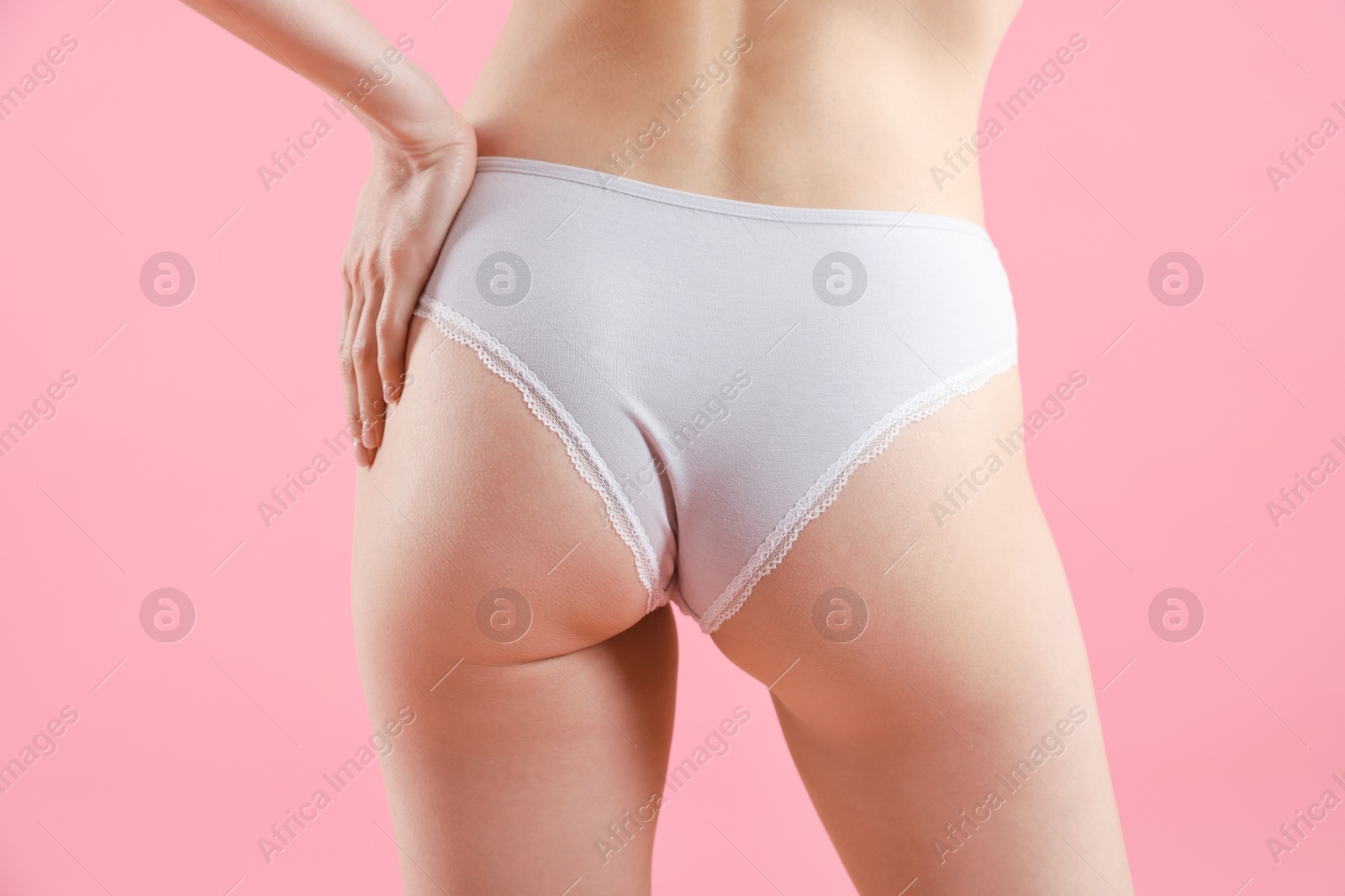 Woman wearing beautiful underwear on pink background, closeup Photo of Woman wearing beautiful underwear on pink background, closeup