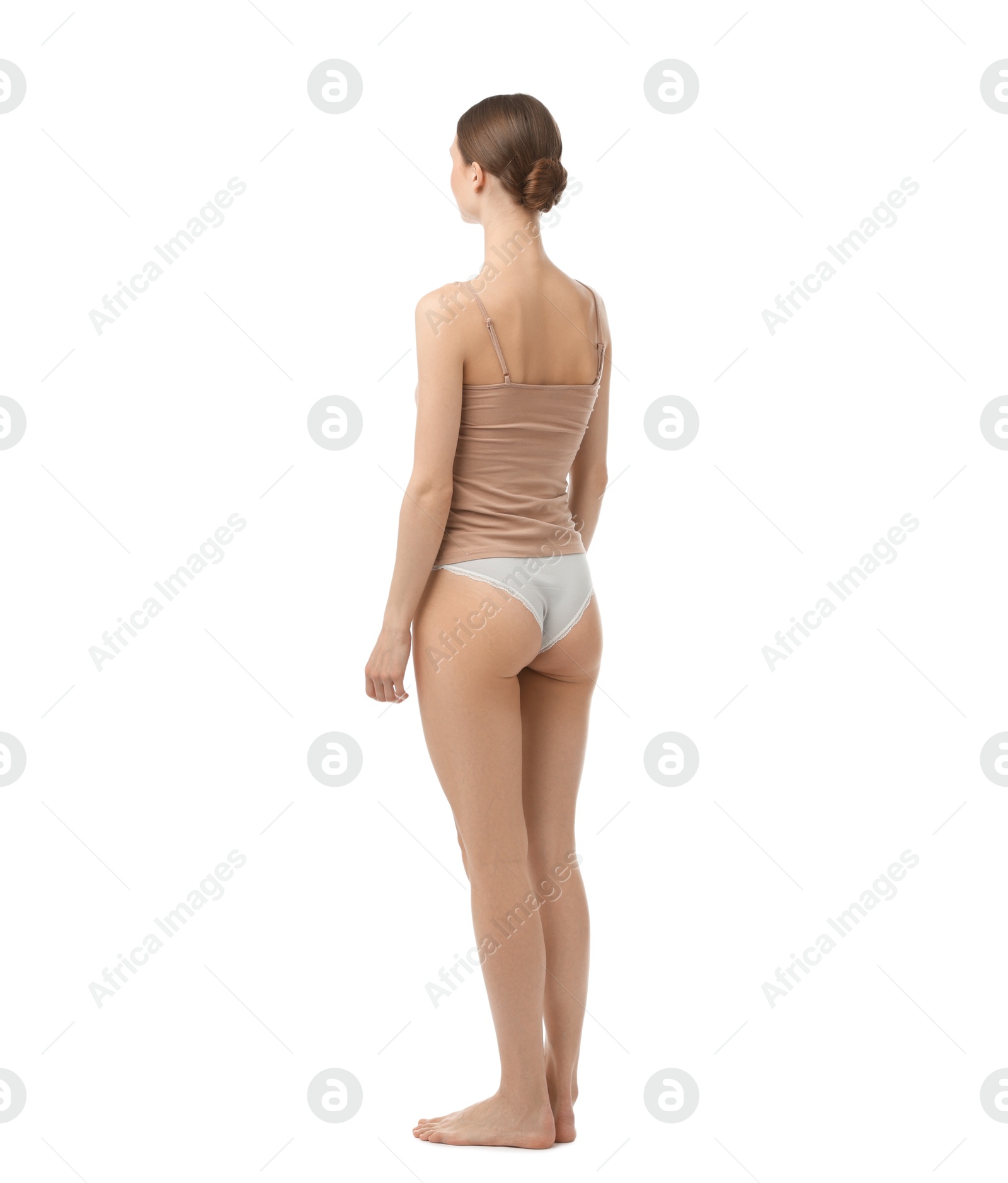 Woman wearing beautiful underwear on white background Photo of Woman wearing beautiful underwear on white background