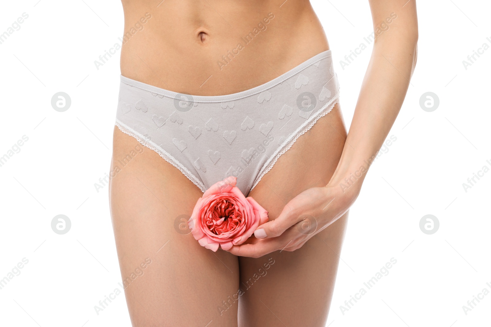 Woman with flower wearing beautiful underwear on white background, closeup Photo of Woman with flower wearing beautiful underwear on white background, closeup