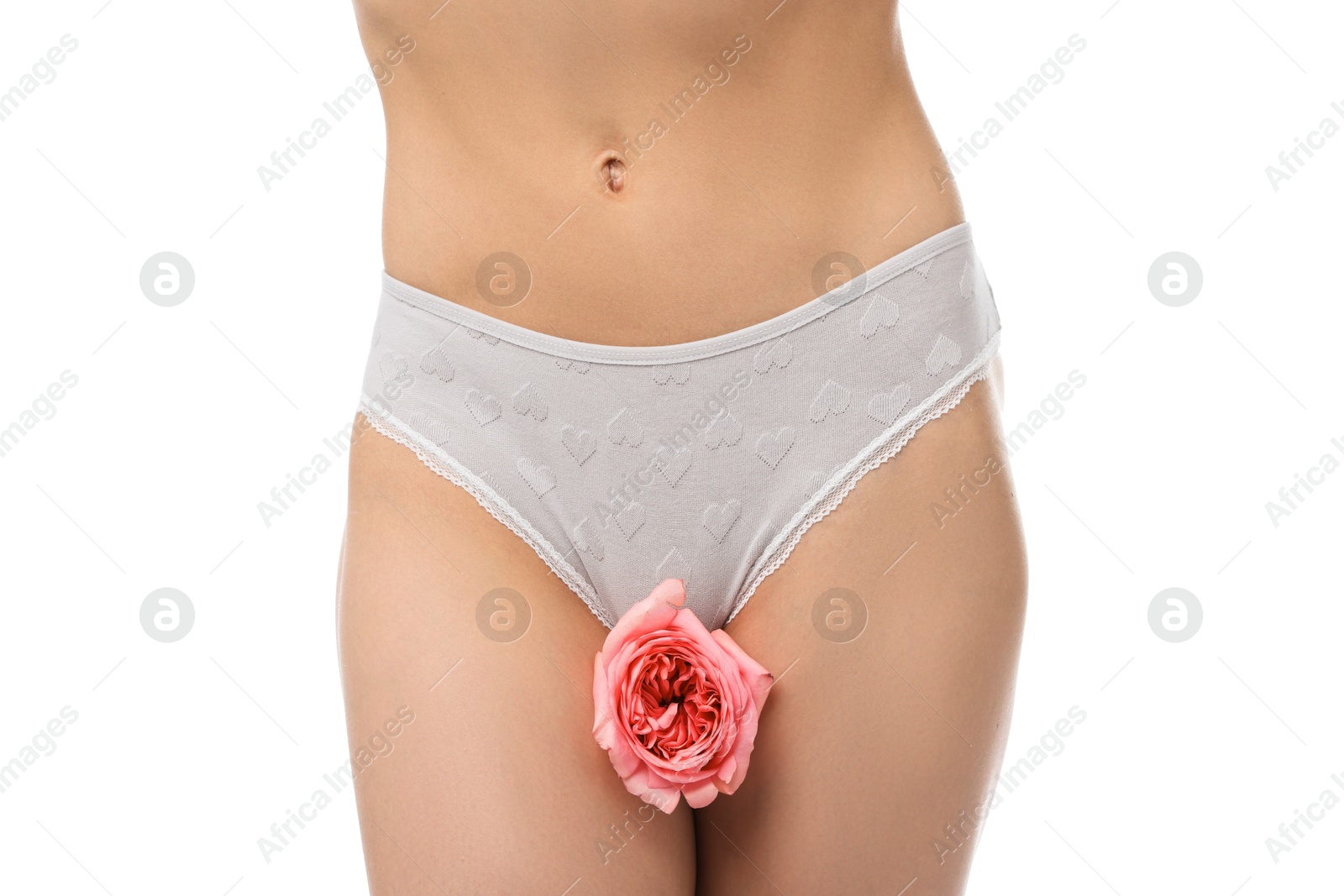 Woman with flower wearing beautiful underwear on white background, closeup Photo of Woman with flower wearing beautiful underwear on white background, closeup
