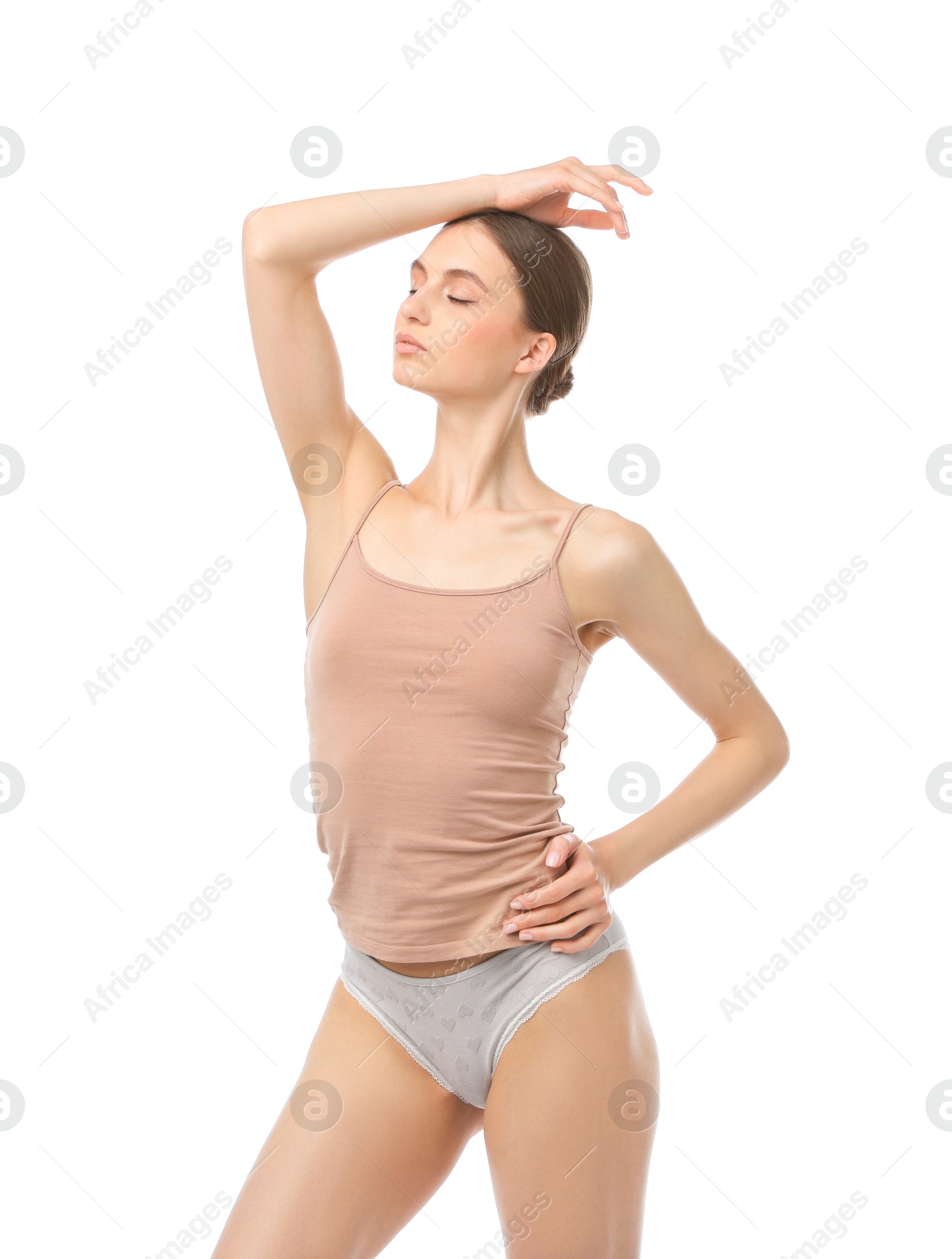 Woman wearing beautiful underwear on white background Photo of Woman wearing beautiful underwear on white background