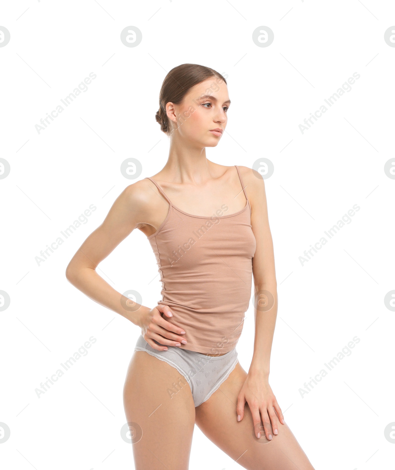 Woman wearing beautiful underwear on white background Photo of Woman wearing beautiful underwear on white background