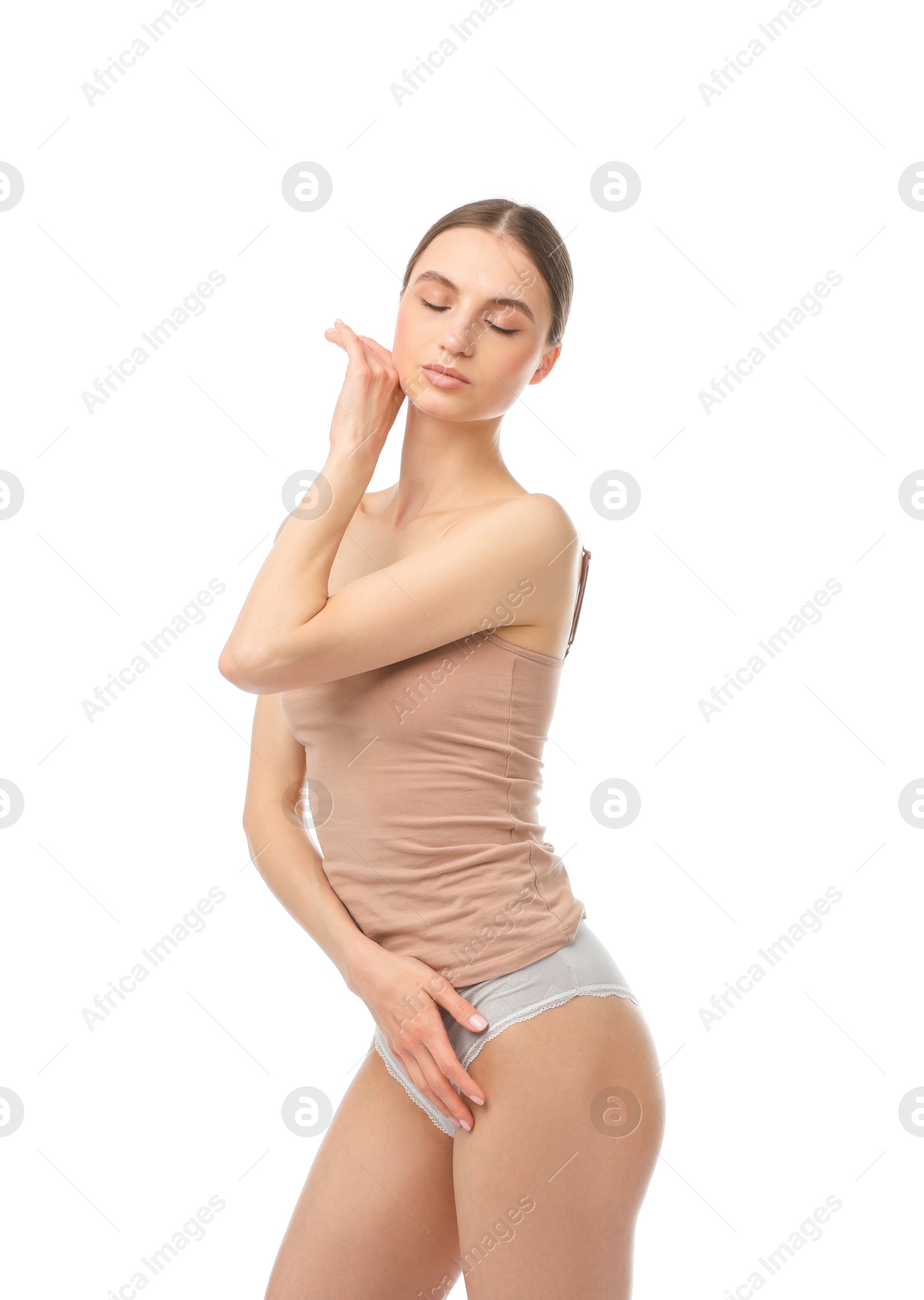 Woman wearing beautiful underwear on white background Photo of Woman wearing beautiful underwear on white background