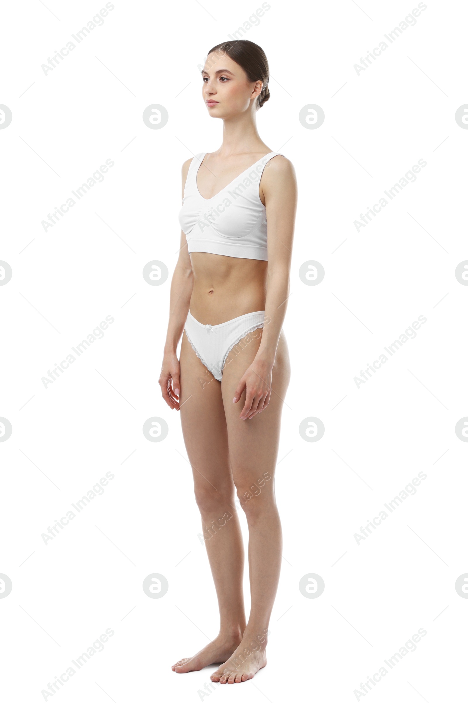 Woman wearing beautiful underwear on white background Photo of Woman wearing beautiful underwear on white background