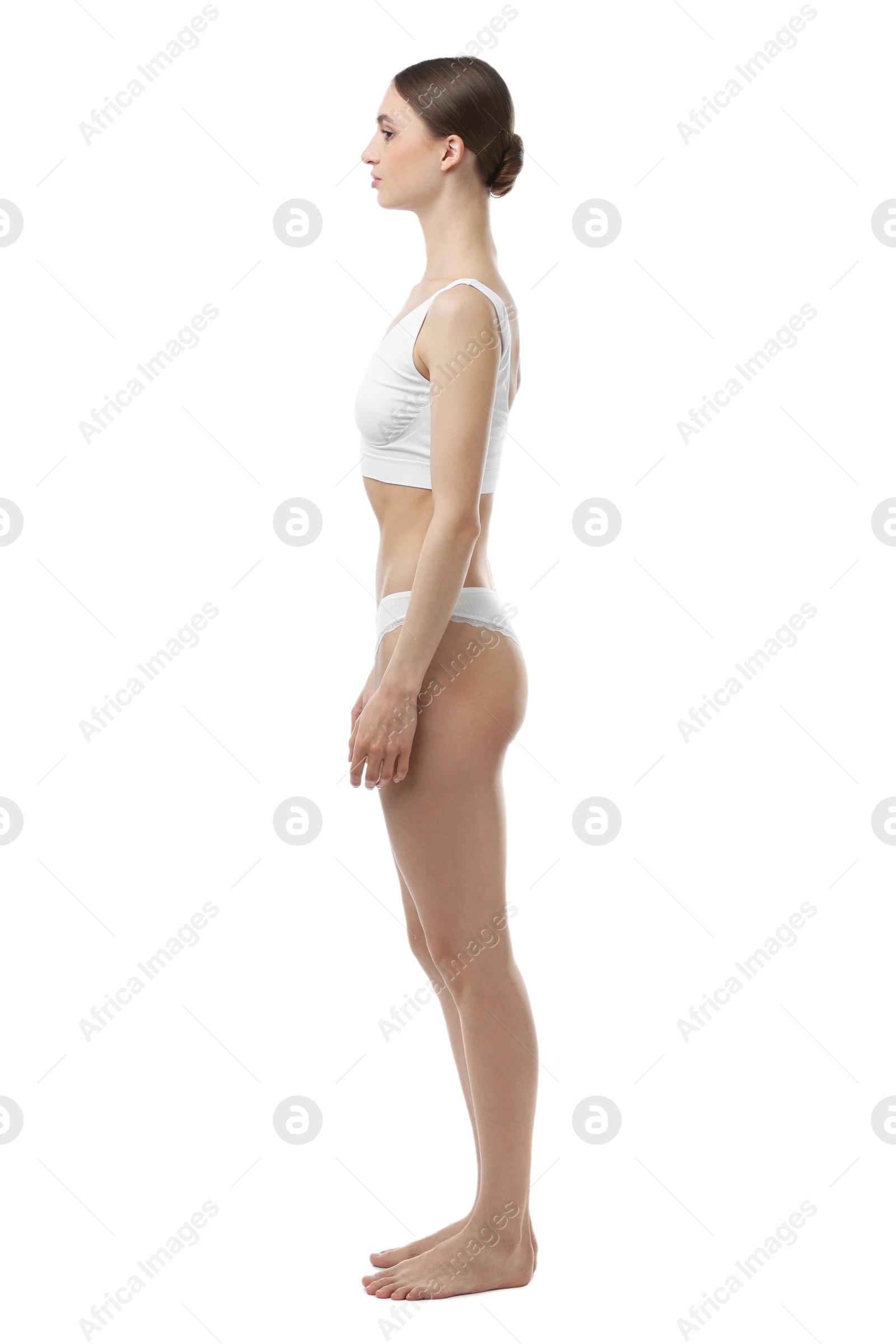Woman wearing beautiful underwear on white background Photo of Woman wearing beautiful underwear on white background