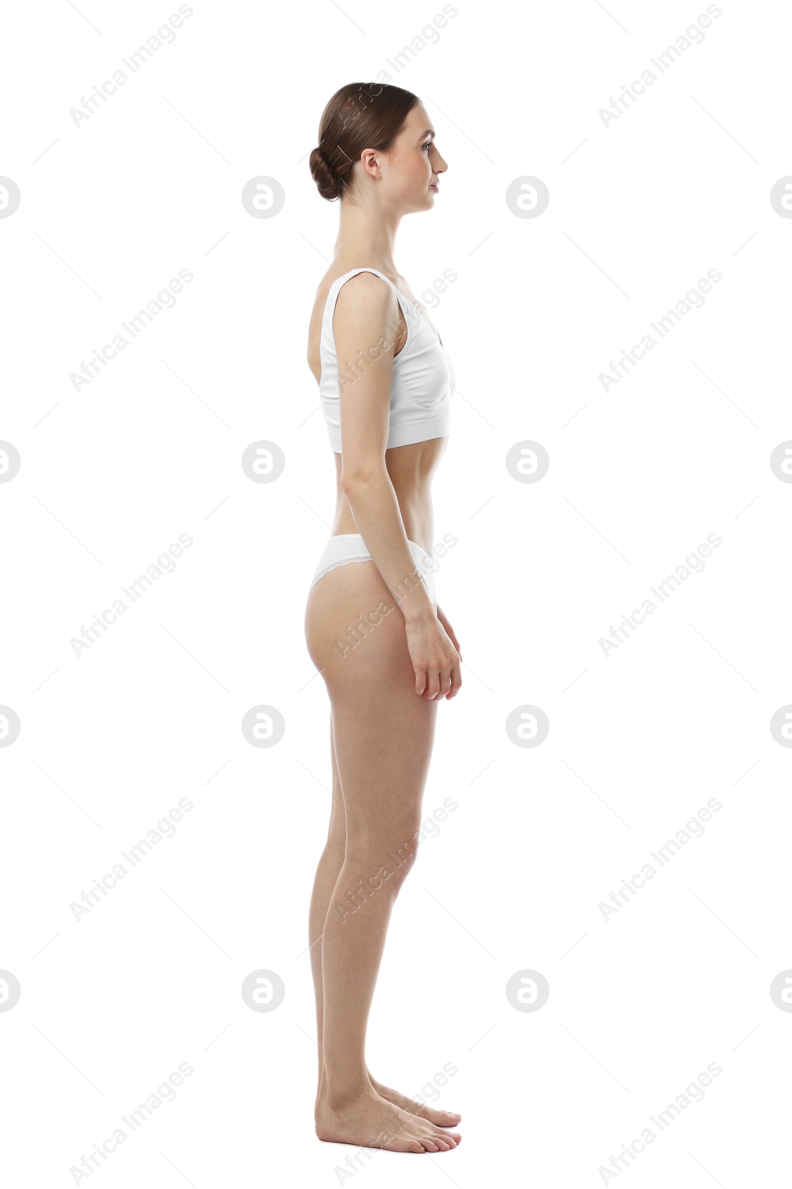 Woman wearing beautiful underwear on white background Photo of Woman wearing beautiful underwear on white background