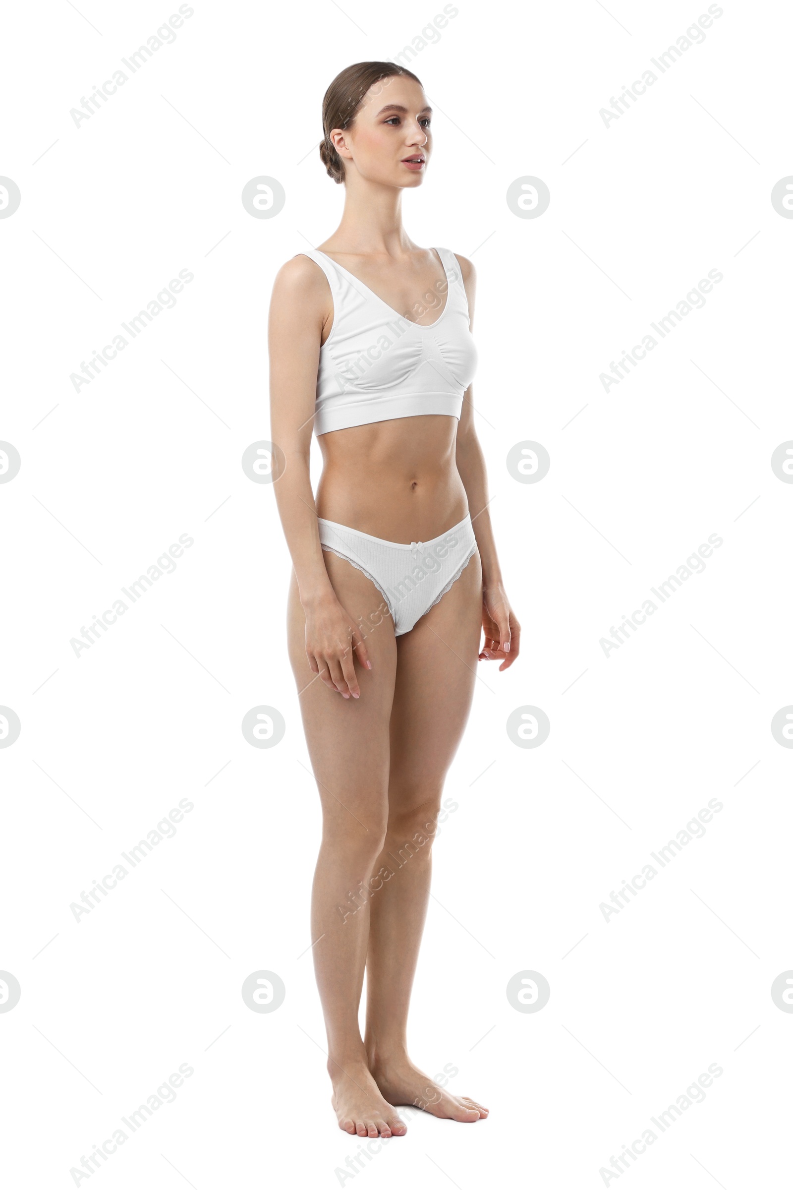 Woman wearing beautiful underwear on white background Photo of Woman wearing beautiful underwear on white background